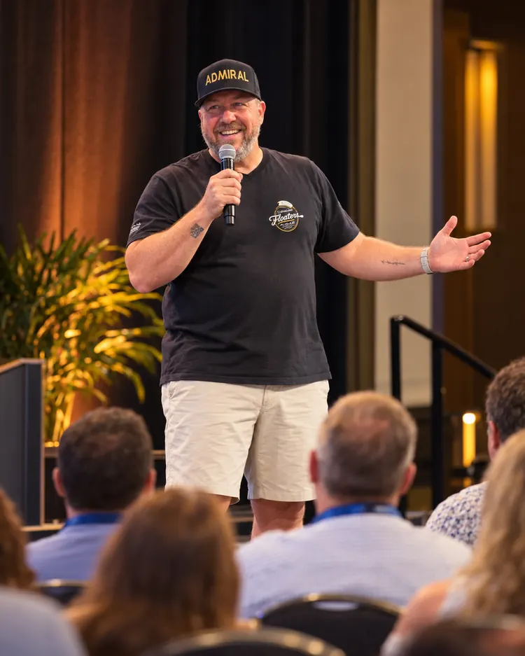 Illustration of Admiral Jim speaking on a conference stage